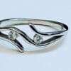 Elegant Sterling Silver Two Stone Hug Ring